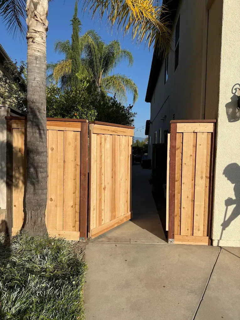 Custom cedar side-yard gates built and hung on new posts